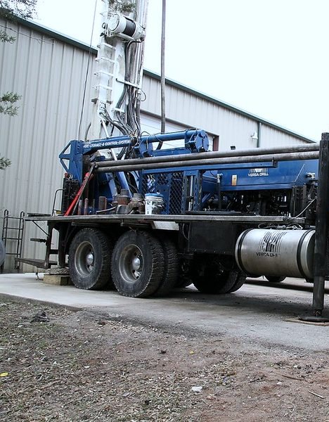 Professional water well drilling rig working at a Wright County property